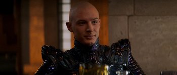 Movie still from “Star Trek: Nemesis” (2002), directed by Stuart Baird – A man with bald head wearing a suit of armor; Close Up shot, Over the shoulder angle