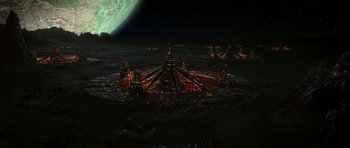 Movie still from “Star Trek: Nemesis” (2002), directed by Stuart Baird – An image of an alien ship in the ocean at night; Extreme Wide shot, High angle