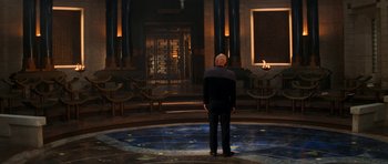 Movie still from “Star Trek: Nemesis” (2002), directed by Stuart Baird – An older man standing in front of an open door; Wide shot, Over the shoulder angle