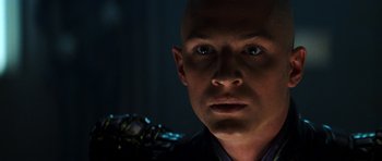 Movie still from “Star Trek: Nemesis” (2002), directed by Stuart Baird – A man with bald head looking into the camera; Close Up shot, Low angle