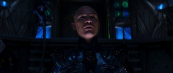 Movie still from “Star Trek: Nemesis” (2002), directed by Stuart Baird – A man with a bald head is looking into the camera; Close Up shot, Low angle