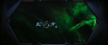 Movie still from “Star Trek: Nemesis” (2002), directed by Stuart Baird – An image of a space ship in the night sky; Extreme Wide shot, Overhead angle