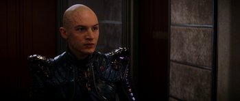 Movie still from “Star Trek: Nemesis” (2002), directed by Stuart Baird – A man with a bald head wearing a suit of armor; Close Up shot, Over the shoulder angle