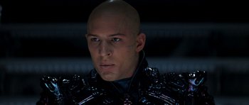 Movie still from “Star Trek: Nemesis” (2002), directed by Stuart Baird – A man with a bald head wearing a black jacket; Close Up shot, Low angle