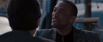 Movie still from “Heat” (1995), directed by Michael Mann – A person talking to another person; Close Up shot, Over the shoulder angle