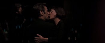 Movie still from “Heat” (1995), directed by Michael Mann – A man and a woman kissing in the dark; Close Up shot, Overhead angle