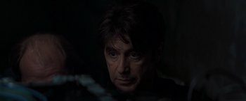 Movie still from “Heat” (1995), directed by Michael Mann – A person looking at the camera; Close Up shot, Low angle