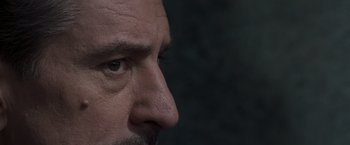 Movie still from “Heat” (1995), directed by Michael Mann – A man's eyes and nose; Extreme Close Up shot, Over the shoulder angle