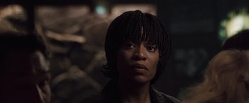 Movie still from “Heat” (1995), directed by Michael Mann – A person wearing a jacket; Close Up shot, Low angle