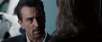 Movie still from “Heat” (1995), directed by Michael Mann – A person talking to another person; Close Up shot, Over the shoulder angle