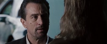 Movie still from “Heat” (1995), directed by Michael Mann – A person talking to another person; Close Up shot, Over the shoulder angle