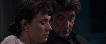 Movie still from “Heat” (1995), directed by Michael Mann – A man and a woman sitting next to each other; Close Up shot, Over the shoulder angle