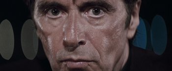 Movie still from “Heat” (1995), directed by Michael Mann – A man's eyes and face; Extreme Close Up shot, High angle