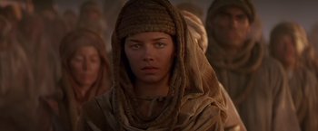 Movie still from “Stargate” (1994), directed by Roland Emmerich – A person wearing a headscarf; Close Up shot, Low angle