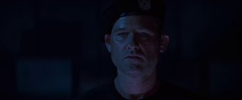 Movie still from “Stargate” (1994), directed by Roland Emmerich – A person wearing a hat; Close Up shot, Low angle