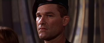 Movie still from “Stargate” (1994), directed by Roland Emmerich – A person wearing a hat; Close Up shot, Low angle