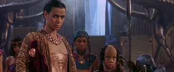 Movie still from “Stargate” (1994), directed by Roland Emmerich – A group of women standing next to each other; Close Up shot, High angle