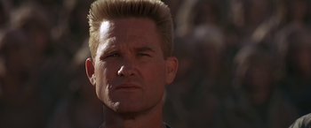 Movie still from “Stargate” (1994), directed by Roland Emmerich – A person wearing a shirt; Close Up shot, Low angle