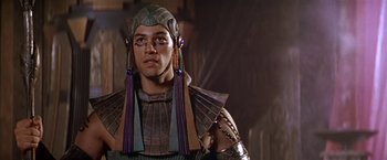 Movie still from “Stargate” (1994), directed by Roland Emmerich – A person wearing a costume; Close Up shot, Low angle