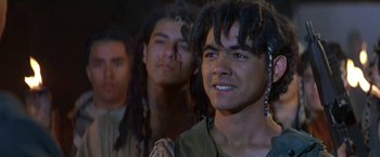 Movie still from “Stargate” (1994), directed by Roland Emmerich – A group of young men standing next to each other; Close Up shot, Over the shoulder angle