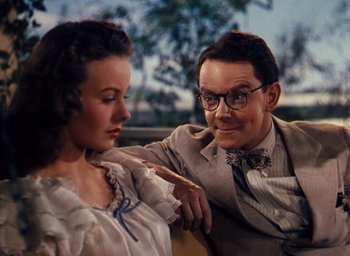 Movie still from “State Fair” (1945), directed by Walter Lang – An older man and a younger woman are sitting together; Close Up shot, Over the shoulder angle