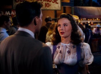 Movie still from “State Fair” (1945), directed by Walter Lang – A man and a woman are talking to each other; Medium shot, Over the shoulder angle