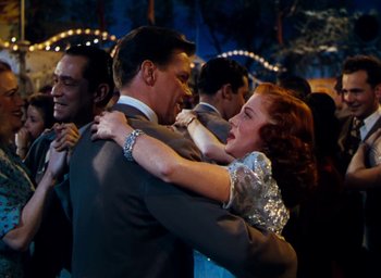 Movie still from “State Fair” (1945), directed by Walter Lang – A man and a woman dancing together at a party; Medium shot, Low angle