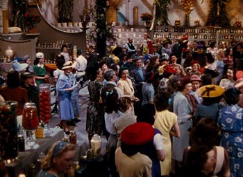 Movie still from “State Fair” (1945), directed by Walter Lang – A group of people standing in a room; Wide shot, High angle