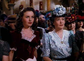 Movie still from “State Fair” (1945), directed by Walter Lang – Two women dressed up for a costume party; Medium shot, Low angle