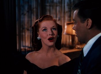 Movie still from “State Fair” (1945), directed by Walter Lang – A man and a woman in a black dress; Close Up shot, Low angle