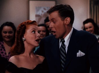 Movie still from “State Fair” (1945), directed by Walter Lang – A man and a woman are standing next to each other; Close Up shot, Low angle