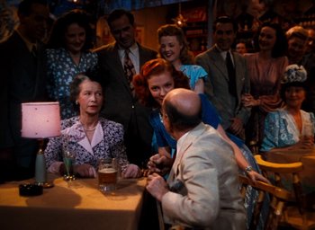 Movie still from “State Fair” (1945), directed by Walter Lang – A group of people sitting around a table; Medium shot, High angle