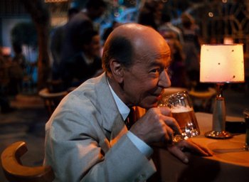 Movie still from “State Fair” (1945), directed by Walter Lang – An older man sitting at a table with a glass of beer; Close Up shot, Over the shoulder angle