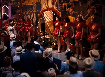 Movie still from “State Fair” (1945), directed by Walter Lang – A crowd of people sitting and standing on a stage; Wide shot, High angle