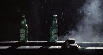 Movie still from “State of Grace” (1990), directed by Phil Joanou – Two beer bottles sitting on top of a bench; Extreme Close Up shot, Overhead angle
