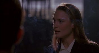 Movie still from “State of Grace” (1990), directed by Phil Joanou – A person wearing a suit and tie; Close Up shot, Over the shoulder angle
