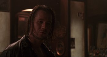 Movie still from “State of Grace” (1990), directed by Phil Joanou – A person with long brown hair; Close Up shot, Over the shoulder angle