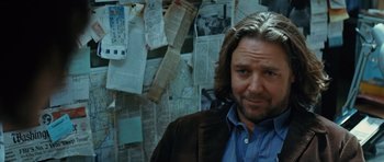 Movie still from “State of Play” (2009), directed by Kevin Macdonald – A person wearing a suit and tie; Close Up shot, Over the shoulder angle