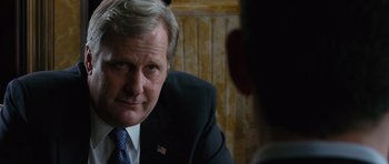 Movie still from “State of Play” (2009), directed by Kevin Macdonald – A person wearing a suit and tie; Close Up shot, Over the shoulder angle