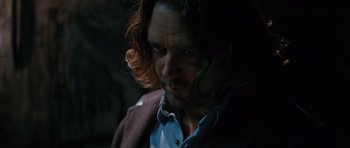 Movie still from “State of Play” (2009), directed by Kevin Macdonald – A person with long hair; Close Up shot, Over the shoulder angle