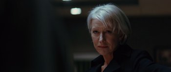 Movie still from “State of Play” (2009), directed by Kevin Macdonald – A person with white hair; Close Up shot, Over the shoulder angle
