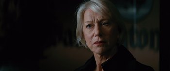 Movie still from “State of Play” (2009), directed by Kevin Macdonald – An older woman with white hair looking at the camera; Close Up shot, Low angle