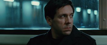 Movie still from “State of Play” (2009), directed by Kevin Macdonald – A person wearing a black jacket; Close Up shot, Low angle