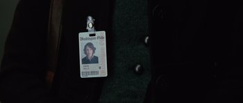 Movie still from “State of Play” (2009), directed by Kevin Macdonald – A washington state identification card sitting next to a suitcase; Extreme Close Up shot, High angle