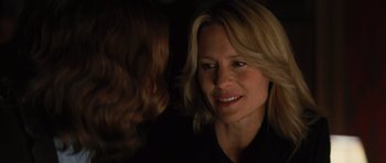 Movie still from “State of Play” (2009), directed by Kevin Macdonald – A person wearing a black shirt; Close Up shot, Over the shoulder angle