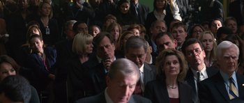 Movie still from “State of Play” (2009), directed by Kevin Macdonald – A group of people standing in a room; Medium shot, High angle