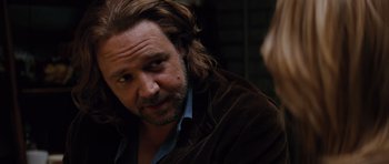 Movie still from “State of Play” (2009), directed by Kevin Macdonald – A person with long brown hair; Close Up shot, Over the shoulder angle