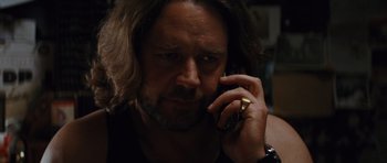 Movie still from “State of Play” (2009), directed by Kevin Macdonald – A person talking on a cell phone; Close Up shot, Low angle