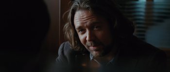 Movie still from “State of Play” (2009), directed by Kevin Macdonald – A person with long brown hair; Close Up shot, Over the shoulder angle