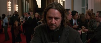 Movie still from “State of Play” (2009), directed by Kevin Macdonald – A person with long hair and a beard; Close Up shot, Over the shoulder angle